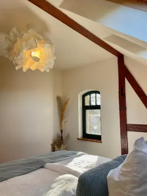 Ein Bett oder Betten in einem Zimmer der Unterkunft Luxus-Ferienwohnung in der Sternkopf-Engel-Villa