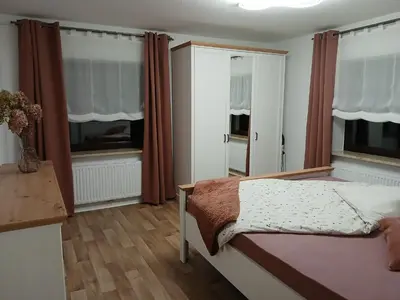 Ein Bett oder Betten in einem Zimmer der Unterkunft Ferienwohnung Waldwinkel