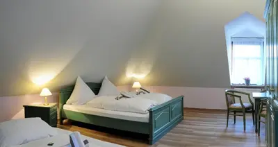 Ein Bett oder Betten in einem Zimmer der Unterkunft Elbterrasse Wachwitz