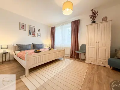 Ein Bett oder Betten in einem Zimmer der Unterkunft Cozy Apartment Old Town Elli42