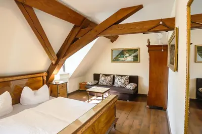 Ein Bett oder Betten in einem Zimmer der Unterkunft Hotel garni Schloss Grochwitz