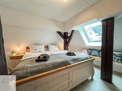 Ein Bett oder Betten in einem Zimmer der Unterkunft Cozy Apartment Rooftop Churchplace