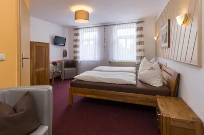 Ein Bett oder Betten in einem Zimmer der Unterkunft Landgasthaus Heiterer Blick