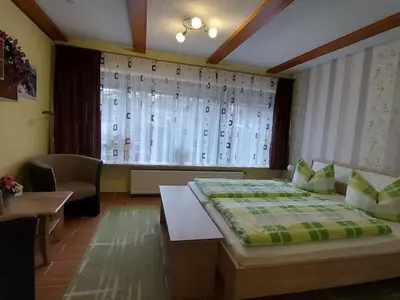 Ein Bett oder Betten in einem Zimmer der Unterkunft at the small Bärenstein