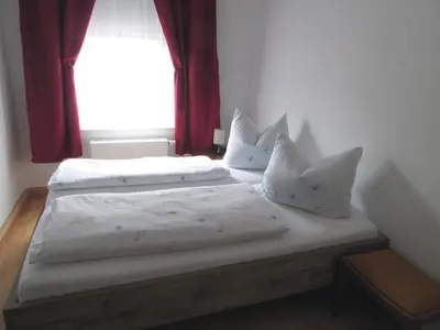 Ein Bett oder Betten in einem Zimmer der Unterkunft Apartment Blaues Haus by Interhome