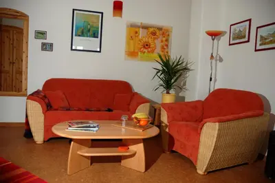 Ein Sitzbereich in der Unterkunft Ökopension Villa Weissig