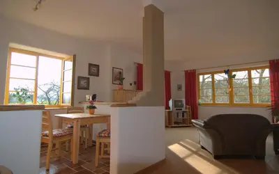 Ein Sitzbereich in der Unterkunft Ökopension Villa Weissig