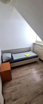 Ein Bett oder Betten in einem Zimmer der Unterkunft Grüna Monteurwohnungen