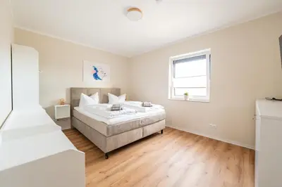 Ein Bett oder Betten in einem Zimmer der Unterkunft Haus Lindolino