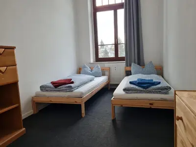 Ein Bett oder Betten in einem Zimmer der Unterkunft Ausblick Freital 4