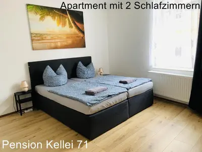 Ein Bett oder Betten in einem Zimmer der Unterkunft Pension Kellei 71