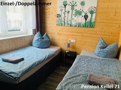 Ein Bett oder Betten in einem Zimmer der Unterkunft Pension Kellei 71