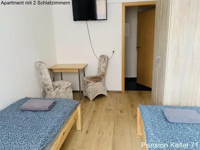 Ein Bett oder Betten in einem Zimmer der Unterkunft Pension Kellei 71