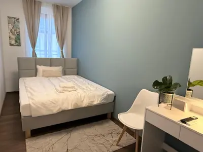 Ein Bett oder Betten in einem Zimmer der Unterkunft Apartmenthaus Döbeln Zentrum