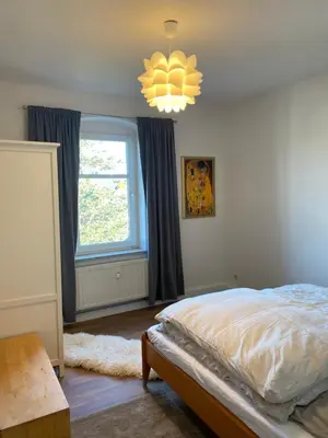 Ein Bett oder Betten in einem Zimmer der Unterkunft Stadtgarten