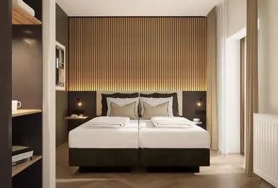 Ein Bett oder Betten in einem Zimmer der Unterkunft Pawlow Hotel