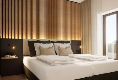 Ein Bett oder Betten in einem Zimmer der Unterkunft Pawlow Hotel