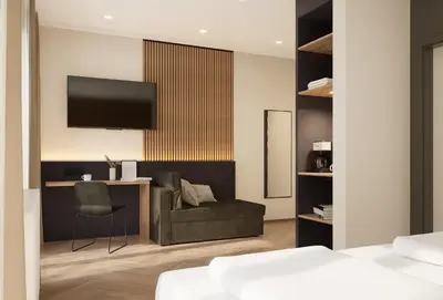 Ein Bett oder Betten in einem Zimmer der Unterkunft Pawlow Hotel