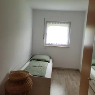 Ein Bett oder Betten in einem Zimmer der Unterkunft Ferienwohnung Weber