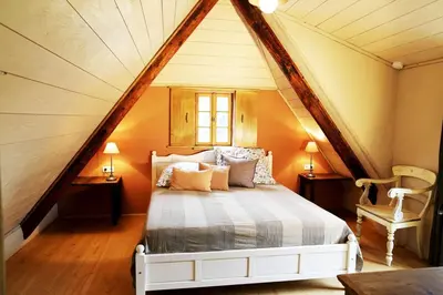Ein Bett oder Betten in einem Zimmer der Unterkunft Ferienhaus Lindenhof Graupa