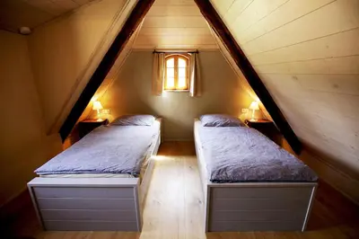 Ein Bett oder Betten in einem Zimmer der Unterkunft Ferienhaus Lindenhof Graupa