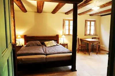 Ein Bett oder Betten in einem Zimmer der Unterkunft Ferienhaus Lindenhof Graupa