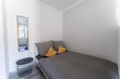 Ein Bett oder Betten in einem Zimmer der Unterkunft Business Apartment Dresden
