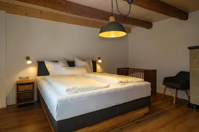 Ein Bett oder Betten in einem Zimmer der Unterkunft Weißes Nest