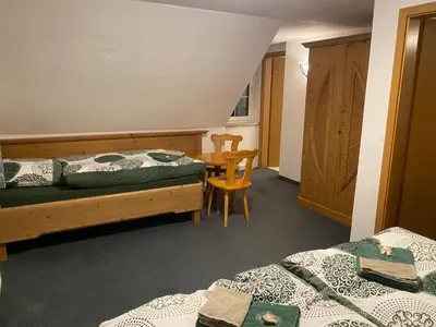 Ein Bett oder Betten in einem Zimmer der Unterkunft Berghaus am Katzenstein urgemütliches Wohnen im Wald