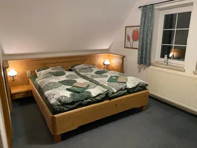 Ein Bett oder Betten in einem Zimmer der Unterkunft Berghaus am Katzenstein urgemütliches Wohnen im Wald