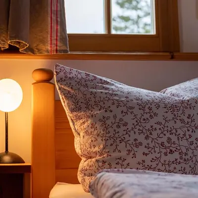 Ein Bett oder Betten in einem Zimmer der Unterkunft Armenhaus Holzhau
