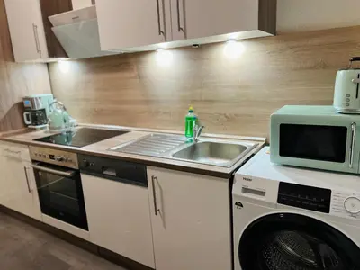 Küche/Küchenzeile in der Unterkunft Moderne Ferienwohnung im Stadtzentrum - ClaraNest