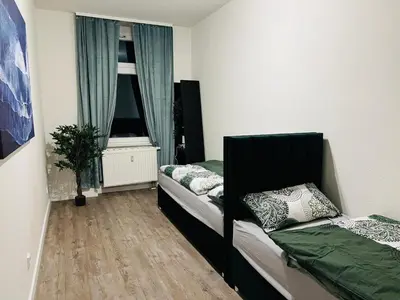 Ein Bett oder Betten in einem Zimmer der Unterkunft Moderne Ferienwohnung im Stadtzentrum - ClaraNest
