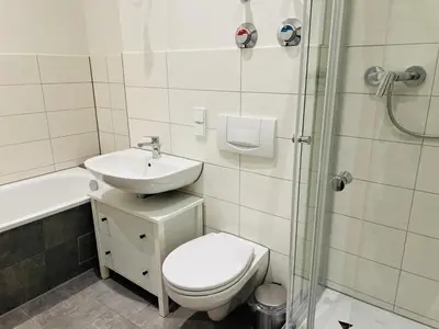 Ein Badezimmer in der Unterkunft Moderne Ferienwohnung im Stadtzentrum - ClaraNest
