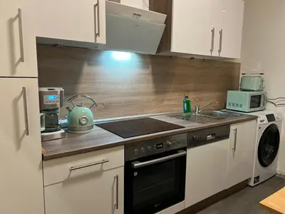 Küche/Küchenzeile in der Unterkunft Moderne Ferienwohnung im Stadtzentrum - ClaraNest