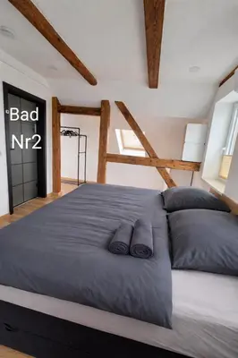 Ein Bett oder Betten in einem Zimmer der Unterkunft Ferienwohnung NR4 DG Klima