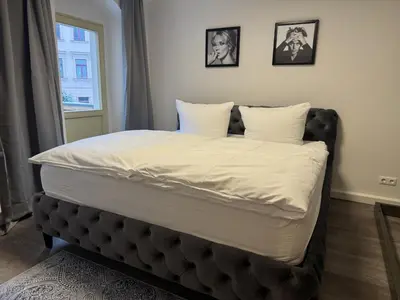 Ein Bett oder Betten in einem Zimmer der Unterkunft Ferienwohnung Wettinstraße mit 2 Schlafzimmern