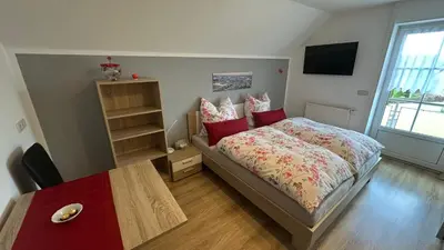 Ein Bett oder Betten in einem Zimmer der Unterkunft Ferienwohnung Berg und Kultur