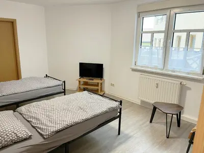 Ein Bett oder Betten in einem Zimmer der Unterkunft Monteurwohnung in Coswig
