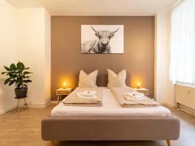 Ein Bett oder Betten in einem Zimmer der Unterkunft Apartment Große Wohnung in Zentrum mit Kleinem Garten by Interhome