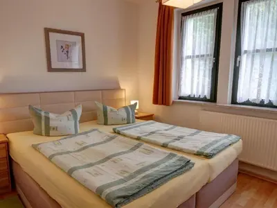 Ein Bett oder Betten in einem Zimmer der Unterkunft Apartment Fewo Schrammsteine by Interhome