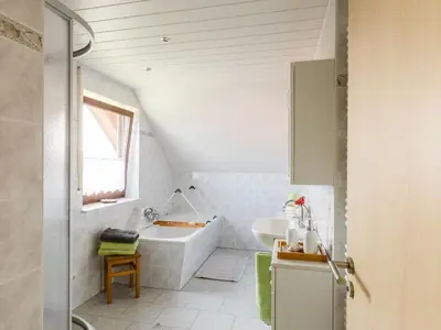 Ein Bett oder Betten in einem Zimmer der Unterkunft Apartment mit Parkplatz und Fahrradunterstellmöglichkeit mit Balkon nah am Wald by Interhome