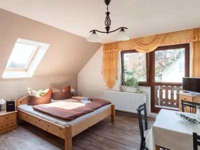 Ein Bett oder Betten in einem Zimmer der Unterkunft Apartment mit Parkplatz und Fahrradunterstellmöglichkeit mit Balkon nah am Wald by Interhome
