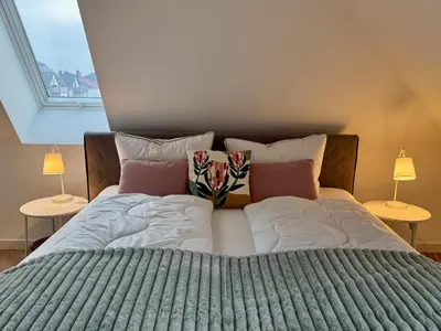 Ein Bett oder Betten in einem Zimmer der Unterkunft Neu!! Ruhige helle Penthouse Wohnung - Parking incl