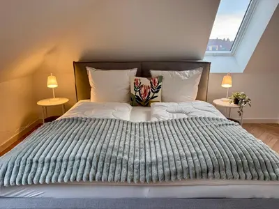 Ein Bett oder Betten in einem Zimmer der Unterkunft Neu!! Ruhige helle Penthouse Wohnung - Parking incl