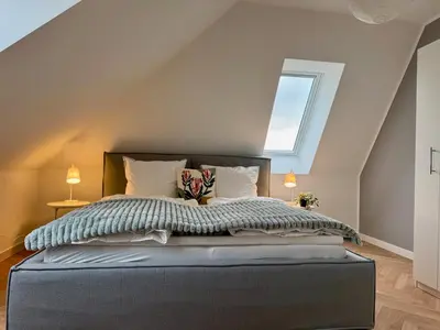 Ein Bett oder Betten in einem Zimmer der Unterkunft Neu!! Ruhige helle Penthouse Wohnung - Parking incl