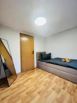 Ein Bett oder Betten in einem Zimmer der Unterkunft Ferienhäuser Radebeul 