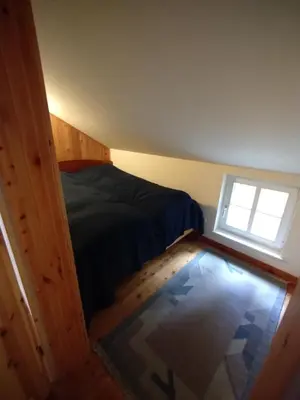 Ein Bett oder Betten in einem Zimmer der Unterkunft Ferienhaus Malepartus Sächsische Schweiz