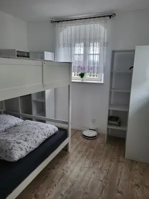 Ein Bett oder Betten in einem Zimmer der Unterkunft Ferienwohnung im sanierten Denkmal max 4 Personen