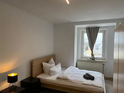 Ein Bett oder Betten in einem Zimmer der Unterkunft Tolle & geräumige Wohnung in Falkenberg